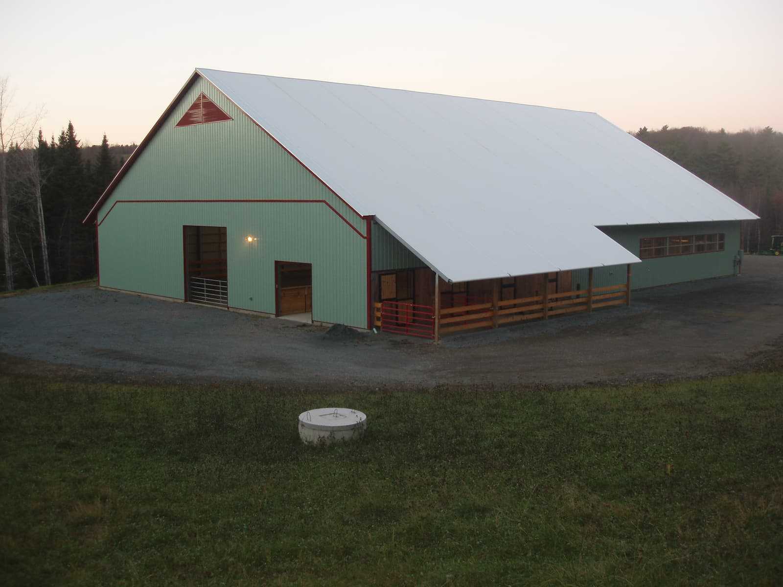 Exterior of a 85’ x 120’ fabric roof riding arena.