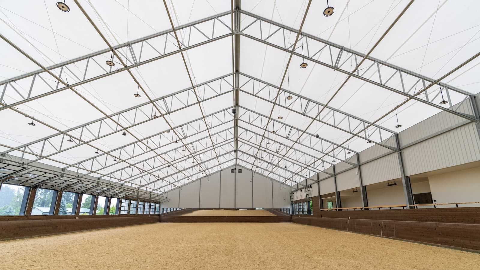 Interior of a 106' x 180' fabric roof riding arena.