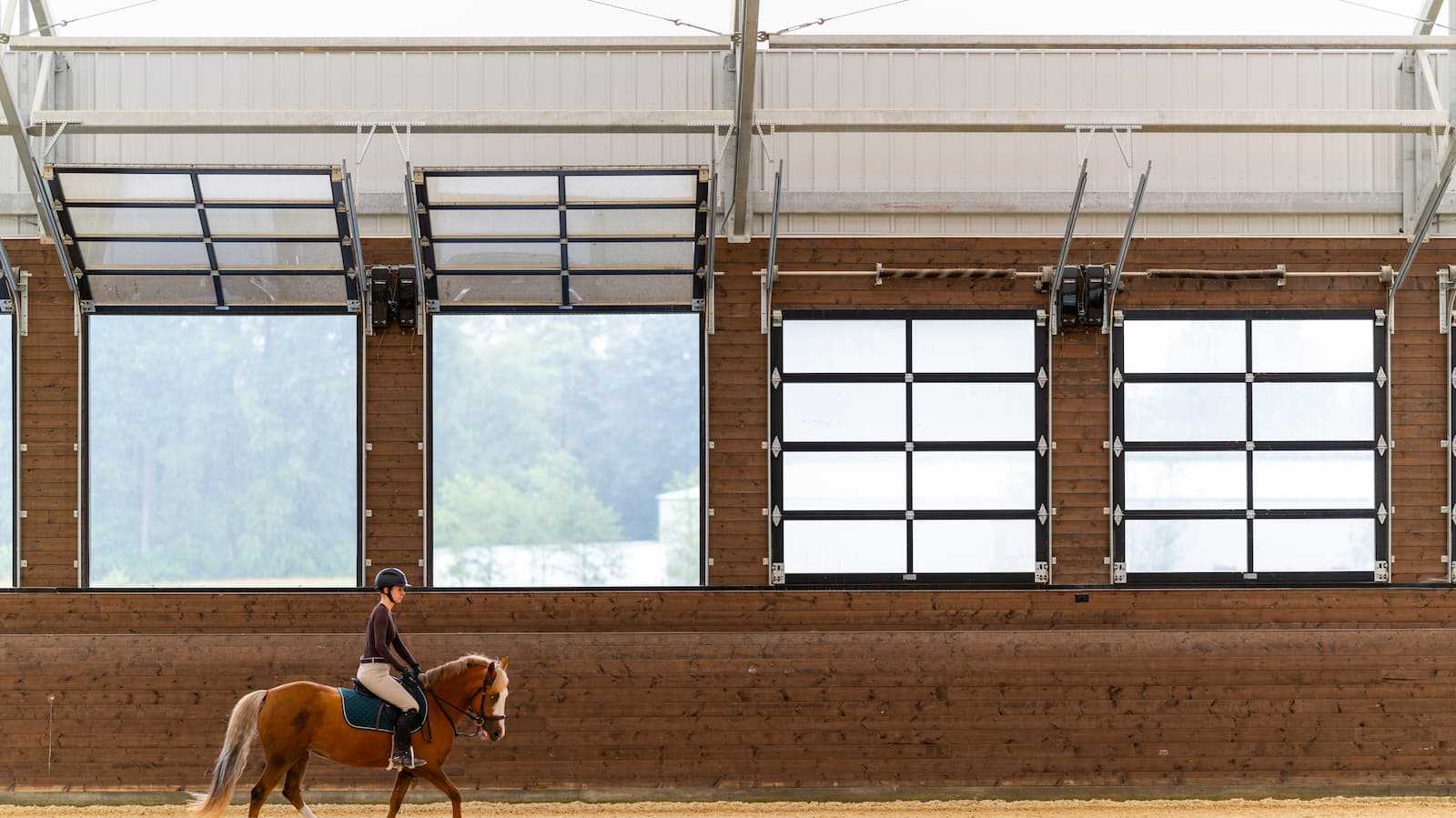 Interior of a 106' x 180' fabric roof riding arena.