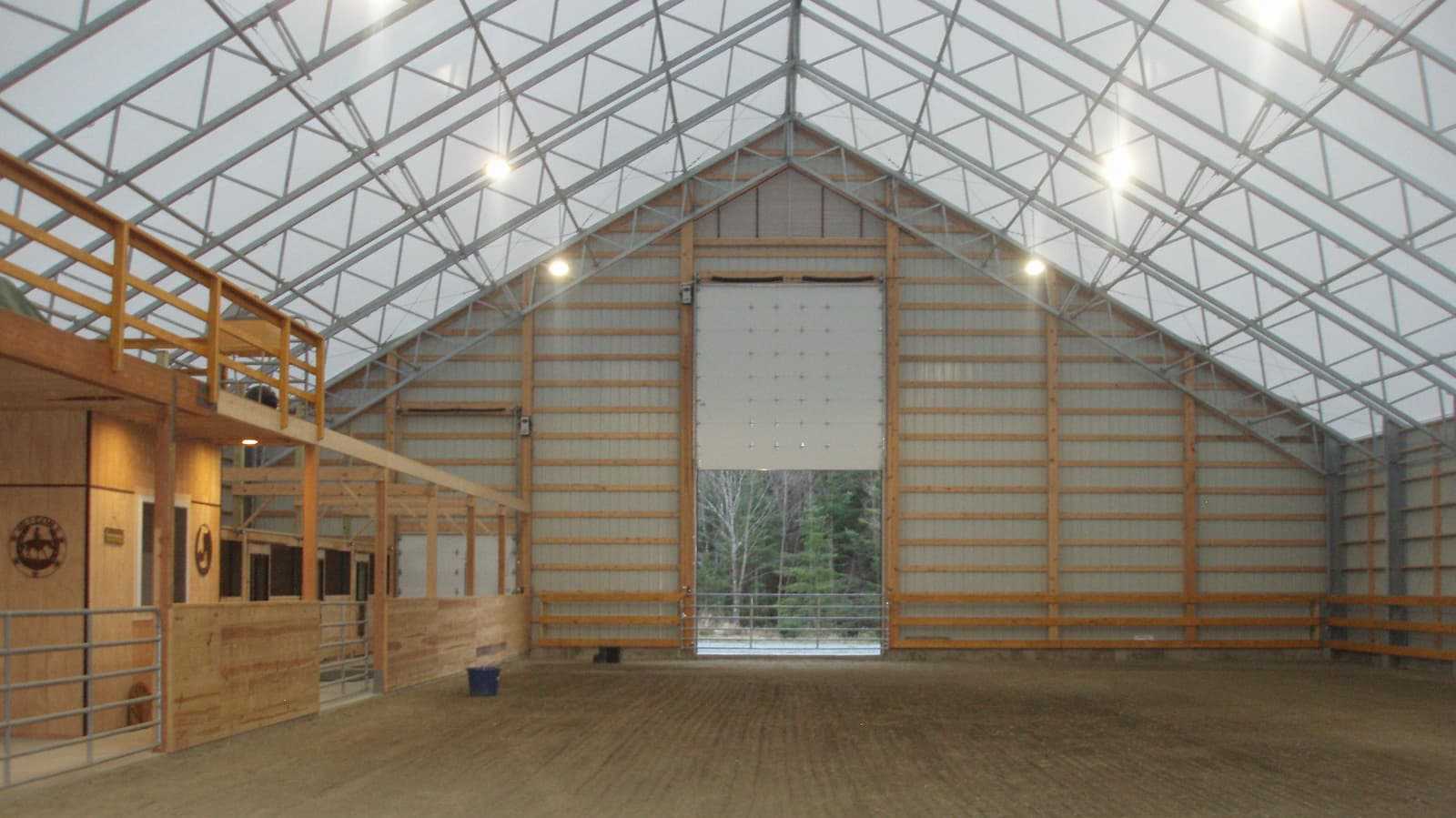 Interior of a 85’ x 120’ fabric roof riding arena.
