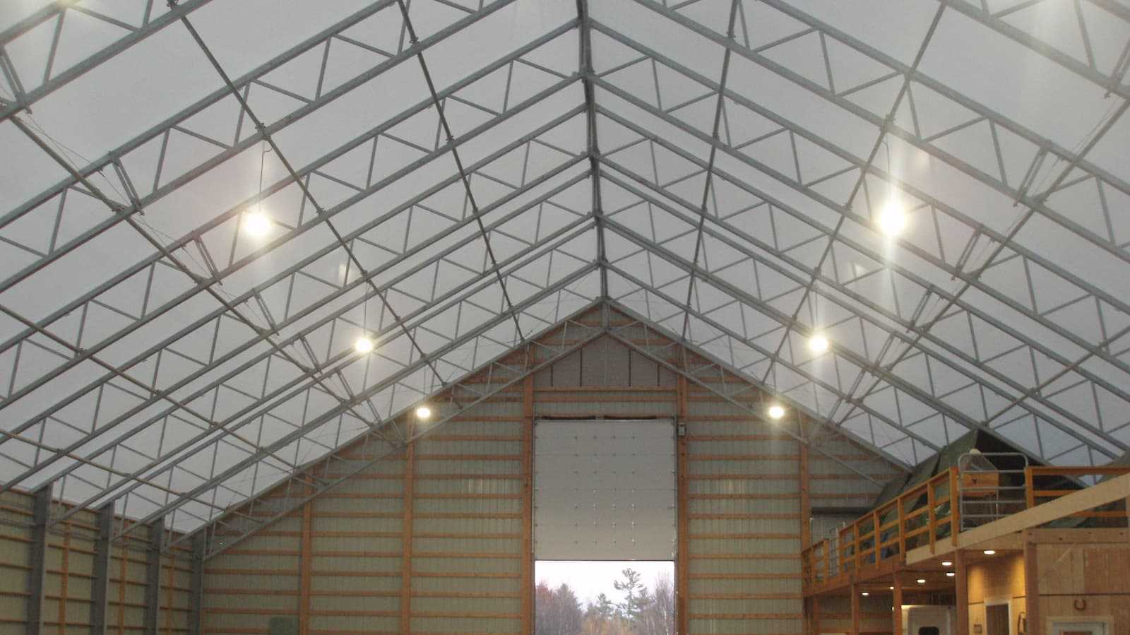 Interior of a 85’ x 120’ fabric roof riding arena.