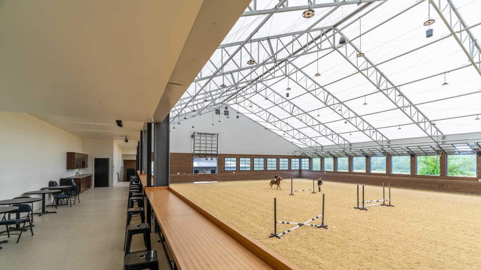 Interior of a 106' x 180' fabric roof riding arena.