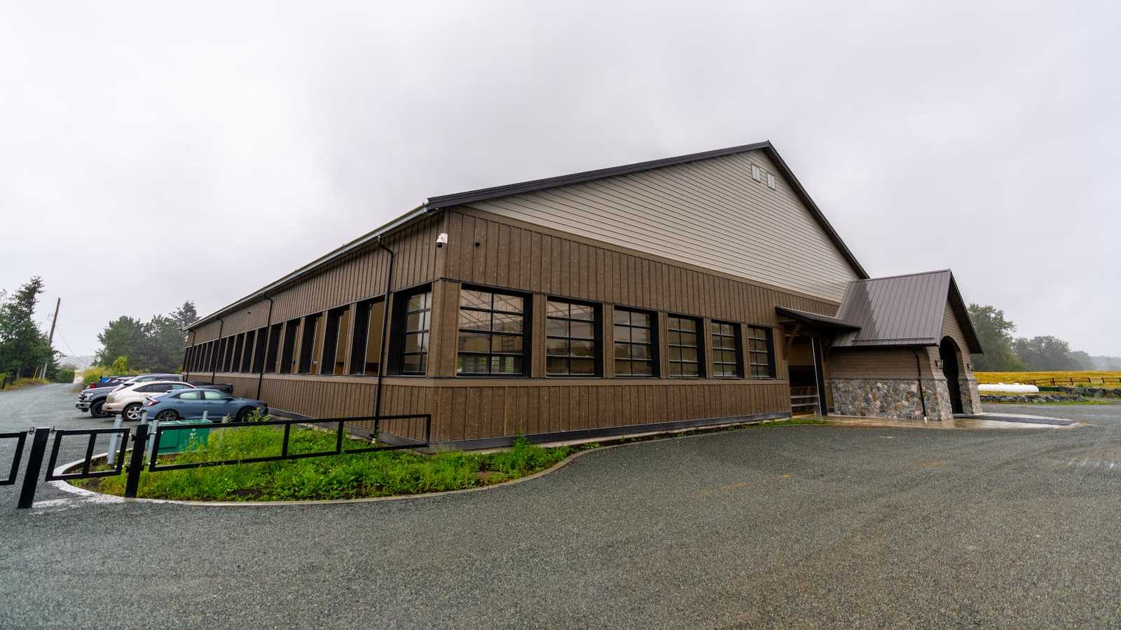 Exterior of a 106' x 180' fabric roof riding arena.
